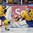 MALMO, SWEDEN - DECEMBER 26: Sweden's Oscar Dansk #35 makes a pad save while Robin Norell #3 looks on during preliminary round action against Switzerland at the 2014 IIHF World Junior Championship. (Photo by Andre Ringuette/HHOF-IIHF Images)
